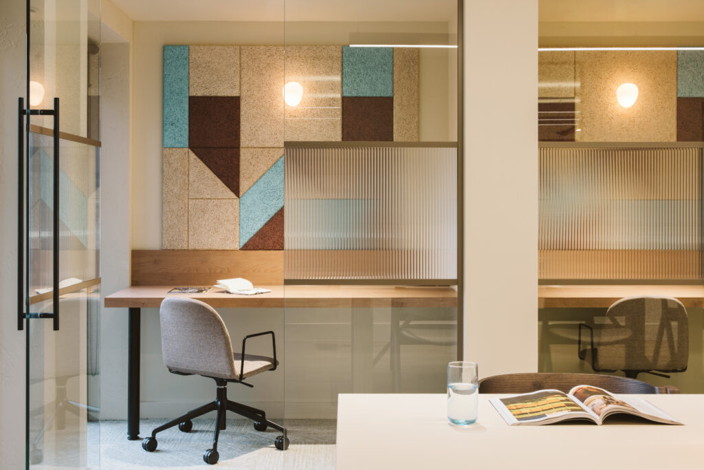 Small meeting pod at Cannon Green with a geometric tiled feature wall, desk and chair