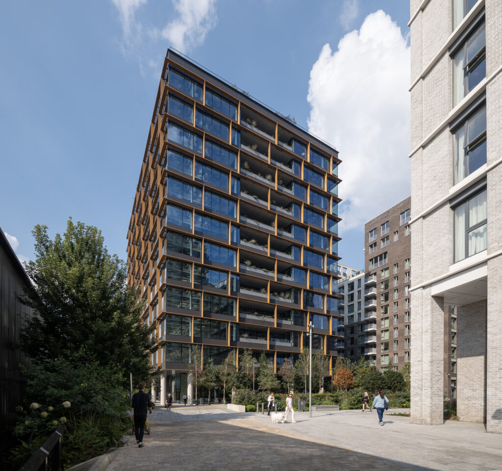 Osmo Nine Elms seen from the landscaped street, with pedestrians and neighbouring apartment blocks